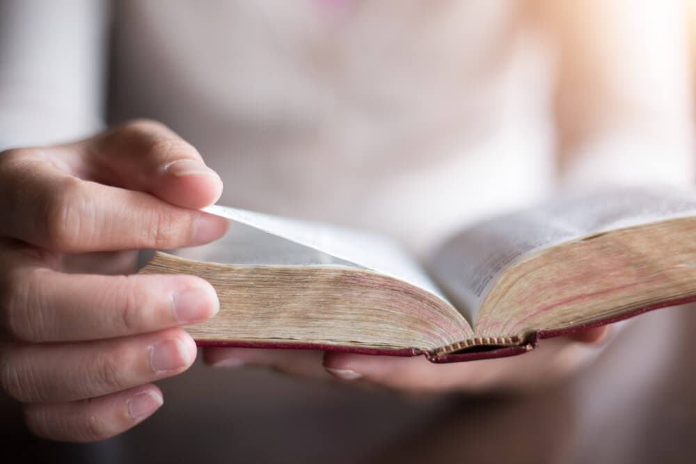 Hands holding bible